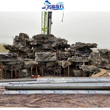 香港九龍英石假山美景九龍園林池塘英石結(jié)合九龍英石布置草坪